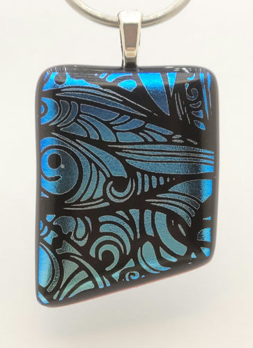 Imagine blue fairy wings as you look at the design etched into the lovely blue dichroic glass of this fused glass pendant!