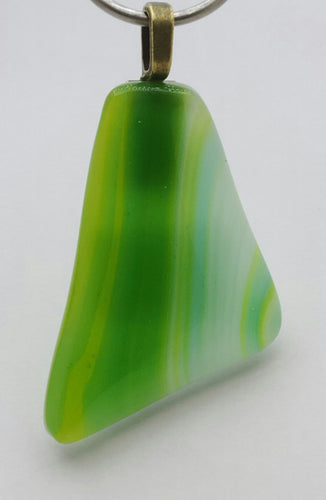 Lime, green, blue, & white swipes dance across this fused glass pendant!