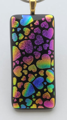Fanciful hearts create a rainbow of color in this etched dichroic fused glass pendant!!