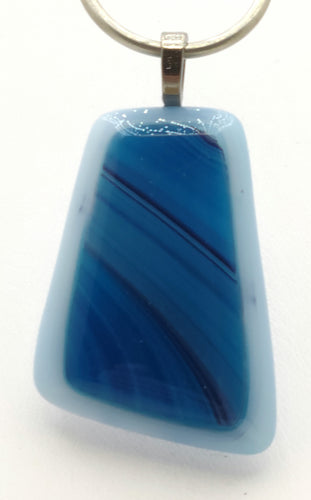 This resembles a paint brush's swipe of blue paint! Fused glass pendant