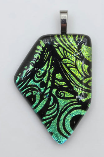 This etched dichroic glass is called fairy wings & the portion used for this fused glass pendant features lovely shades of green!