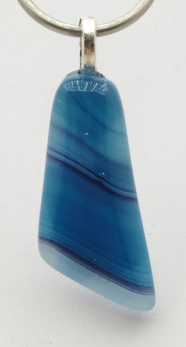 A clear glass cap adds depth to the striations of this blue multi-hued pendant!