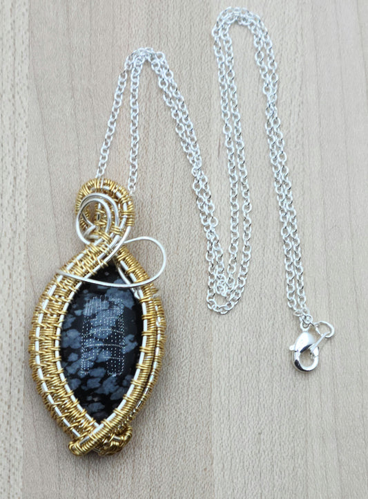 silver and gold framed snowflake obsidian woven wire pendant