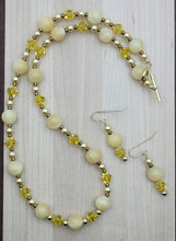 Add some sunshine to your look with our Honey Stone & Crystal Necklace & Earrings.