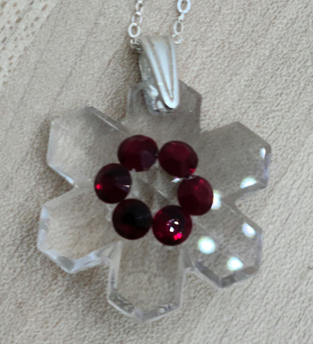 crystal snowflake pendant with deep red crystal decoration