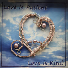 woven wire Melon Pink Heart Shadow Box reads Love is patient, love is kind