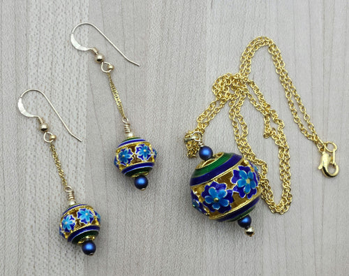Indulge in luxury with our Blue & Gold Cloisonné Flowers Necklace & Earrings.