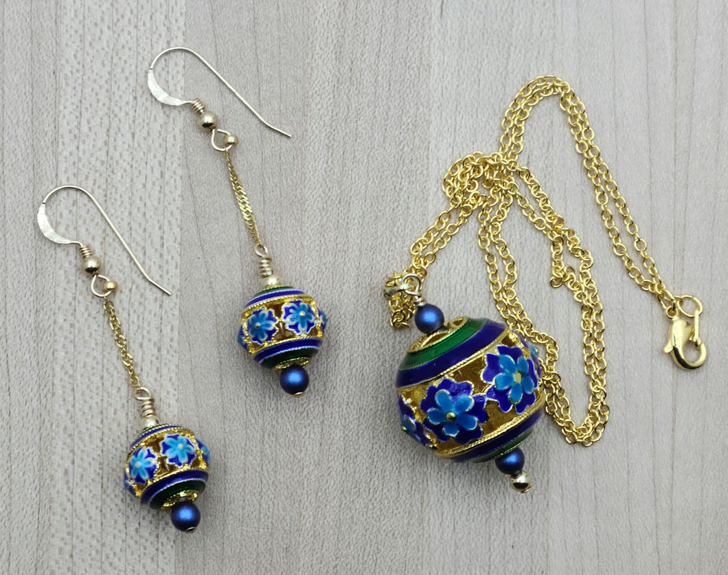Indulge in luxury with our Blue & Gold Cloisonné Flowers Necklace & Earrings.
