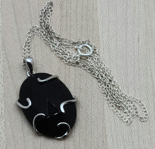 Faceted Onyx Pendant with free form sterling silver bezel & sterling silver frame