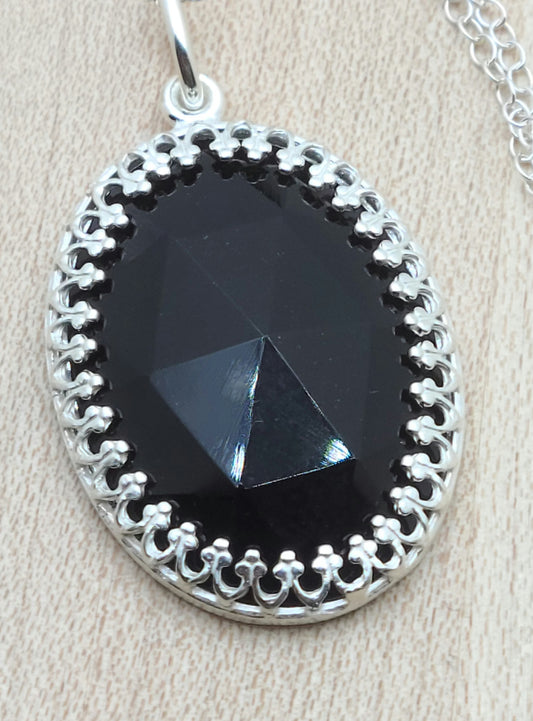 Faceted Oval Onyx Pendant in Sterling Silver Bezel Frame