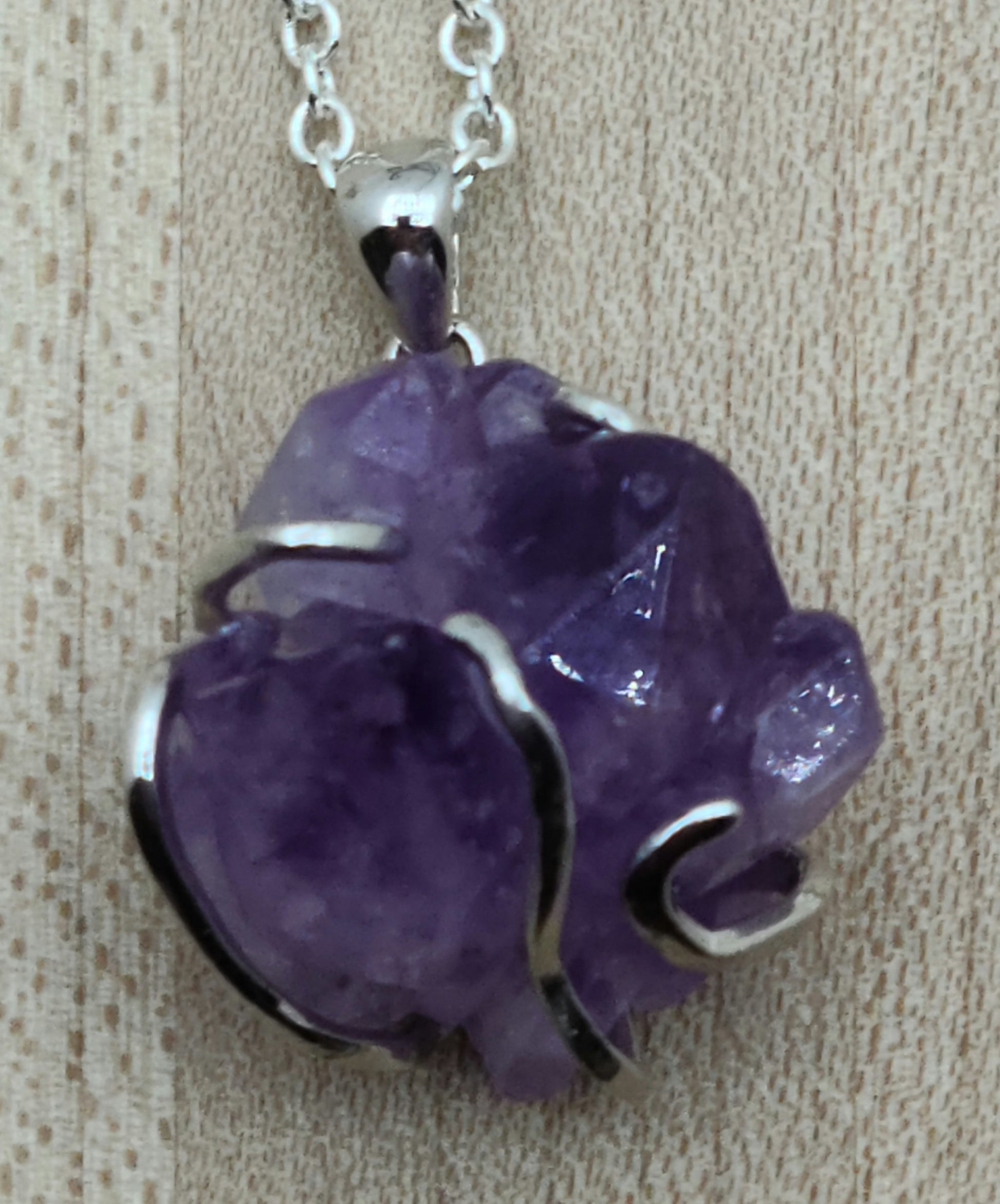 This striking amethyst rock is 'hugged' by a free form sterling silver bail for a very free-spirited look!