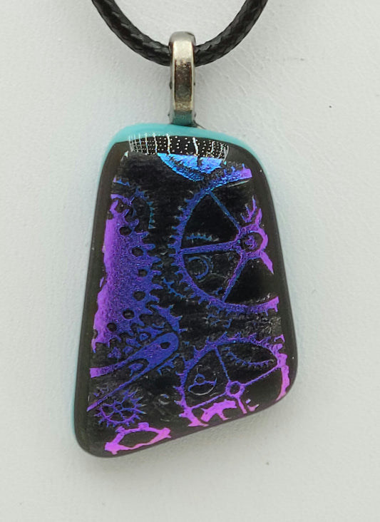 Tiny cogs etched on purple dichroic fused glass pendant