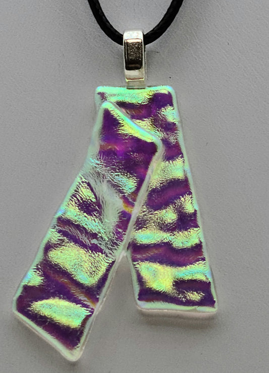 These dichroic glass ribbons with let a bit of the colors you're wearing influence the color of the pedant.