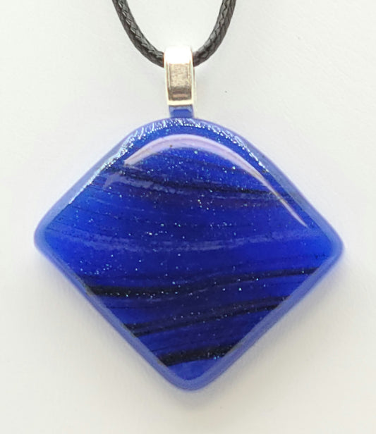 The blue in this fused glass pendant has tiny sparkles in it!
