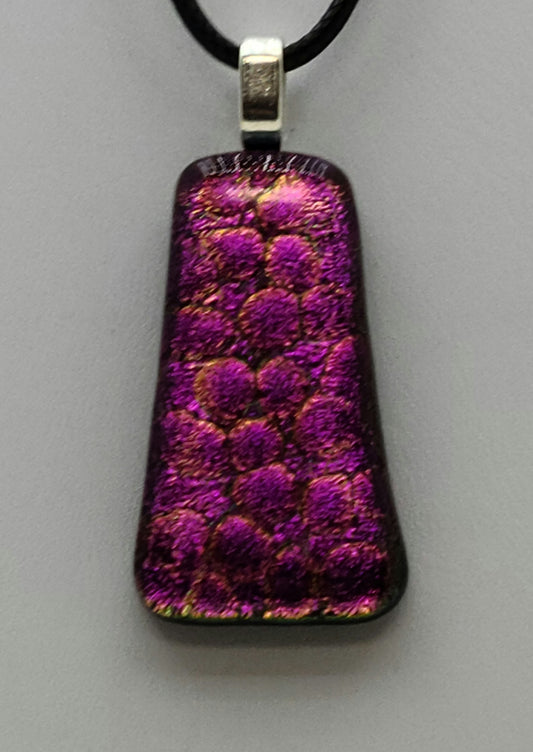 This dichroic fused glass pendant is like looking at fuchsia pebbles through clear water!