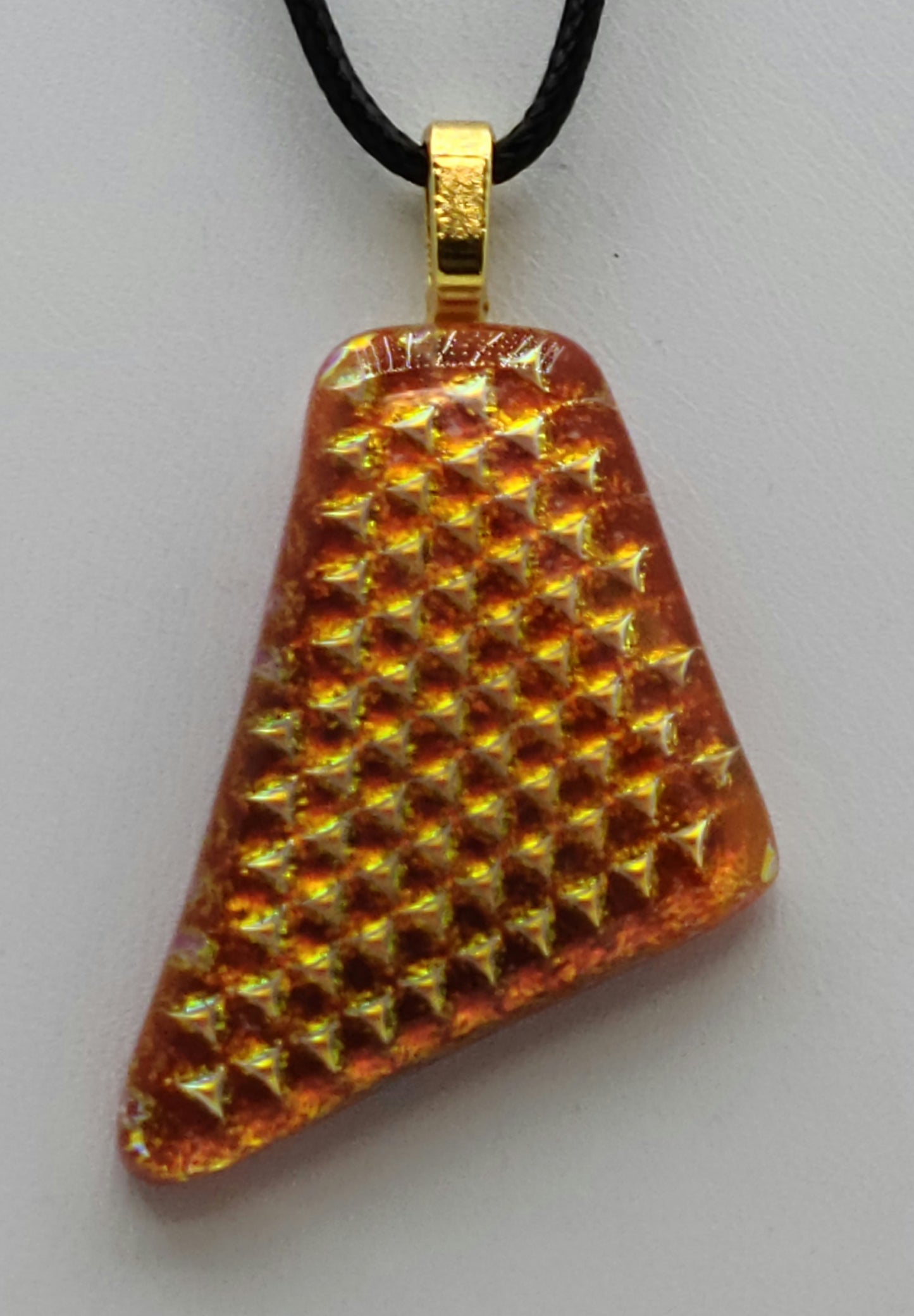 This textured dichroic was fused texture side in to give it this wonderful golden reflection.