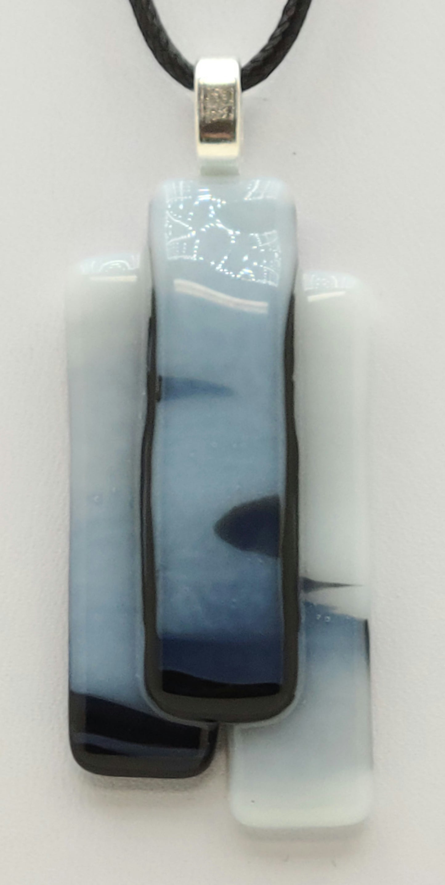 3 strips of black & white glass are tack fused & slumped together for an interesting fused glass pendant.