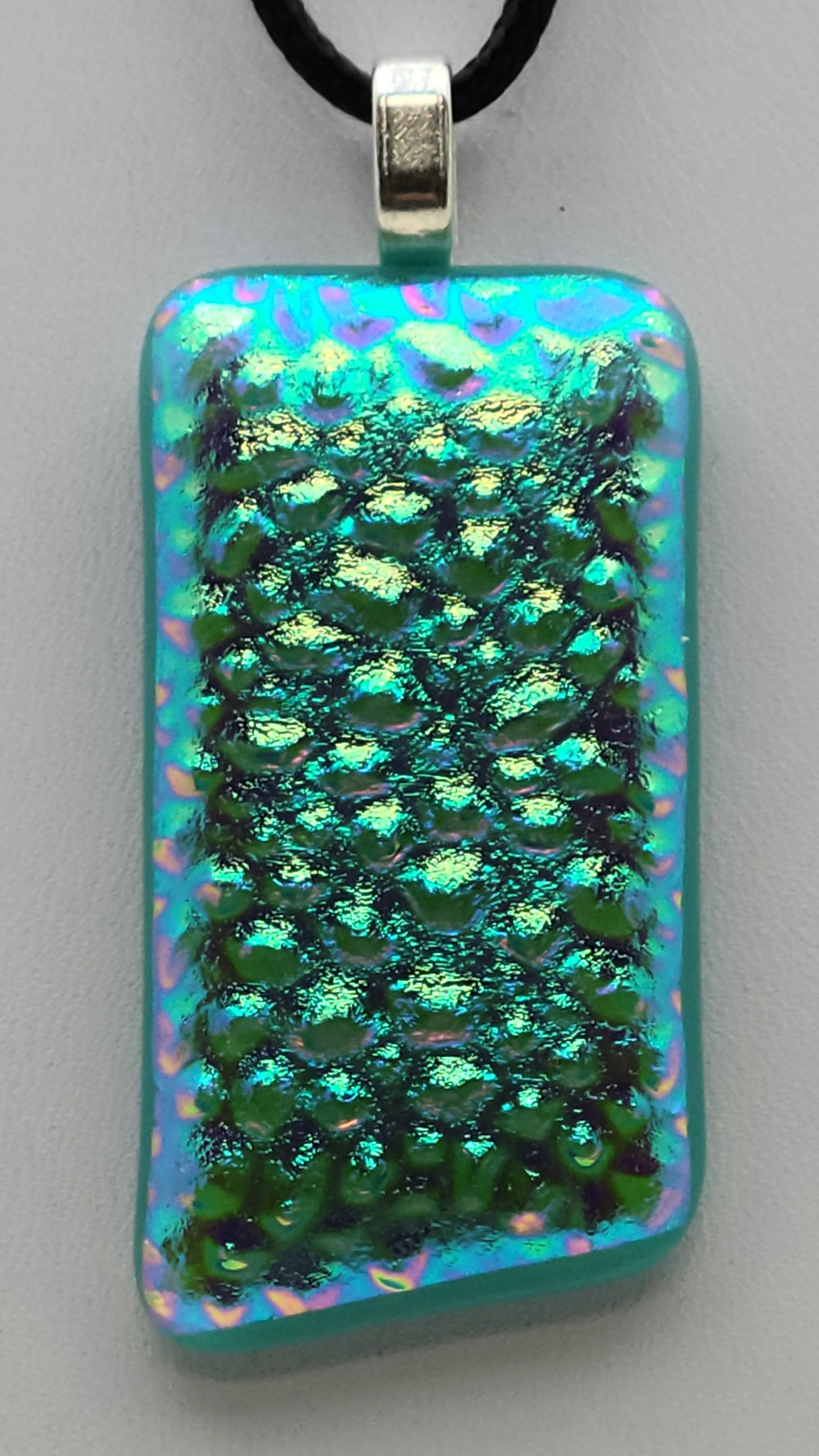 Lovely, textured dichroic fused glass pendant in shiny aqua.