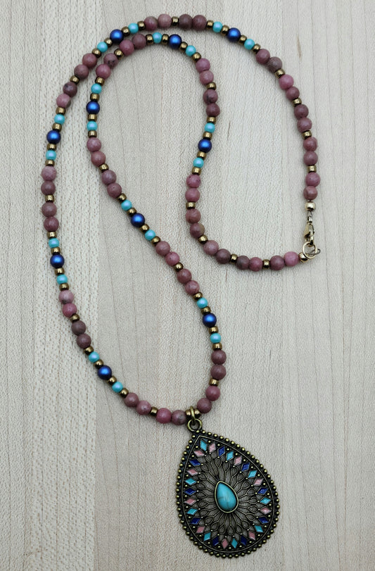Brighten your day with this playful Pink/Blue/Turquoise Teardrop Necklace.