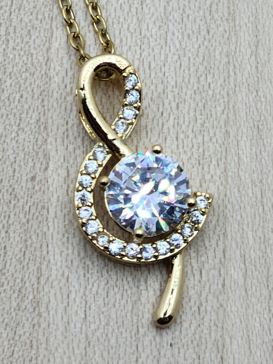 The large cubic zirconia in this gold filled treble clef is definitely an eye-catcher without being 'too much.' It is delicately surrounded by smaller CZ stones.