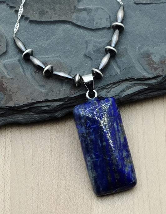Lapis lazuli is a beautiful stone, prized for its deep blue color. It is said to promote wisdom & self-awareness. Navajo style silver is a lovely, often oxidized sterling silver. Together they create a lovely necklace.