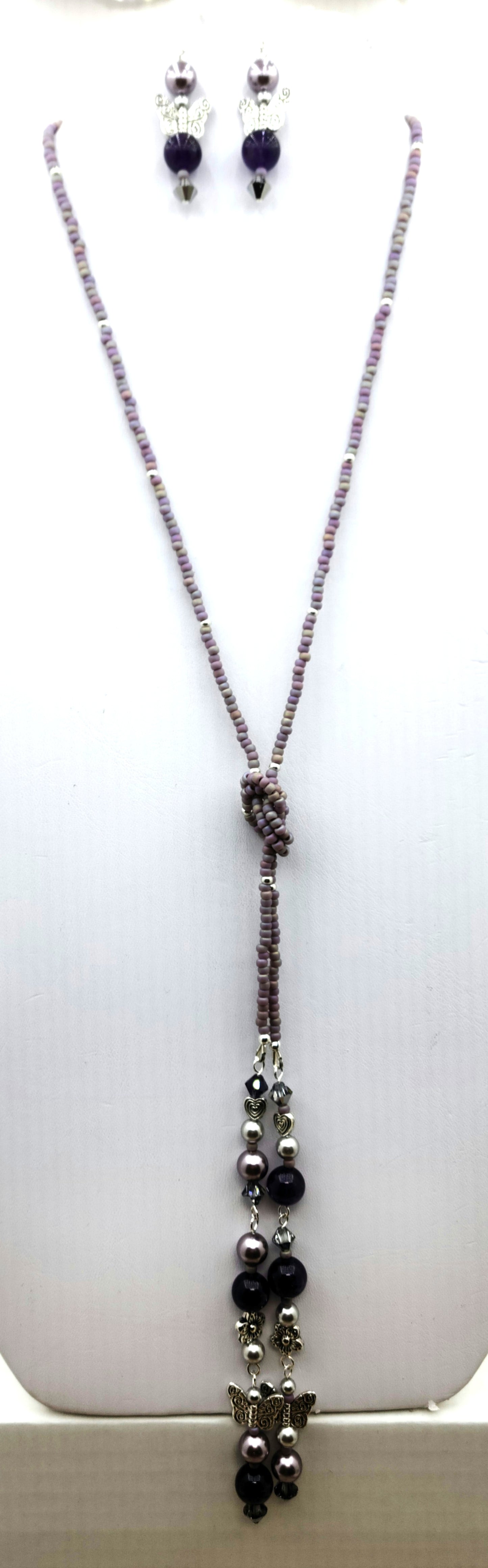 Be your own stylist! Lariat necklaces are such fun! This one features amethyst quartz, pewter butterflies, flowers, & hearts; crystals & crystal pearls; & Miyuki (the best brand) seed beads. There is a lot here to create interest!
