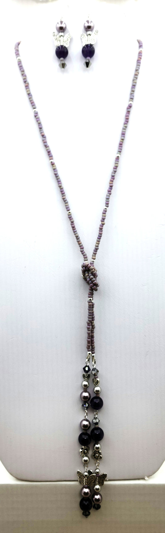 Be your own stylist! Lariat necklaces are such fun! This one features amethyst quartz, pewter butterflies, flowers, & hearts; crystals & crystal pearls; & Miyuki (the best brand) seed beads. There is a lot here to create interest!