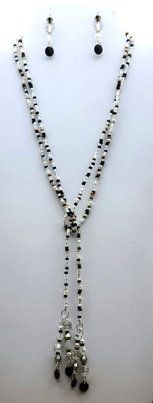 Be your own stylist with this versatile lariat necklace, reminiscent of a New Year's Eve party with its black, white, silver, & gold elements!
You have crystals & crystal pearls & Miyuki (the best brand) seed beads.