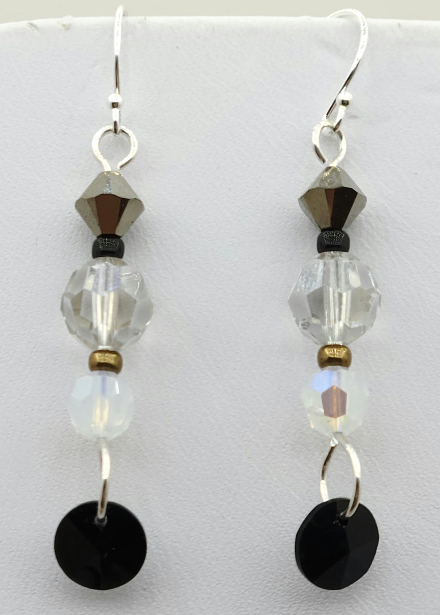 Be your own stylist with these fun earrings, reminiscent of a New Year's Eve party with their black, white, silver, & gold elements!
You have crystals & crystal pearls & Miyuki (the best brand) seed beads.