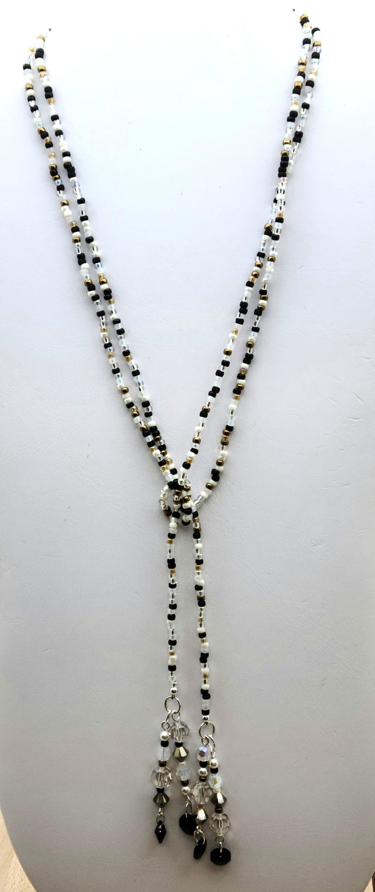 Be your own stylist with this versatile lariat necklace, reminiscent of a New Year's Eve party with its black, white, silver, & gold elements!
You have crystals & crystal pearls & Miyuki (the best brand) seed beads.