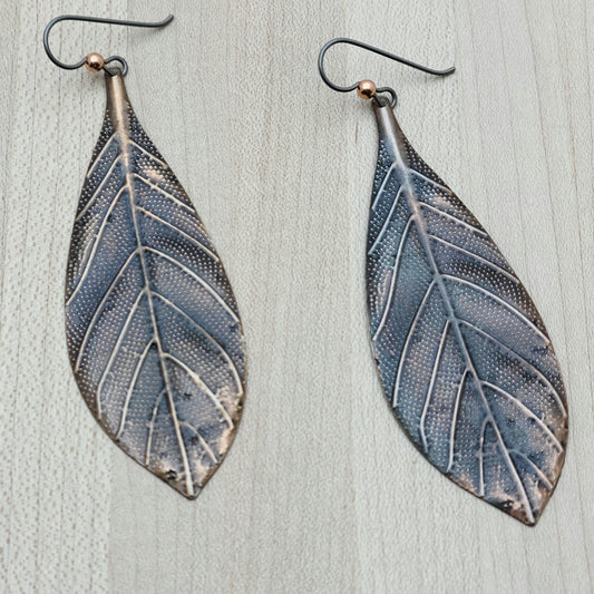 long, lightweight copper leaves suspended from hypoallergenic niobium ear wires