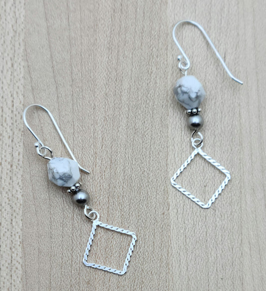 Faceted white & grey howlite & crystal pearls host angled sterling silver square donuts. Sterling silver fish hook ear wires.
