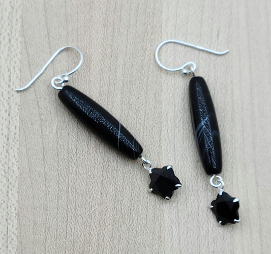 Sterling silver set black cubic zirconia 'flowers' add sparkle to lovely, long tibetan 'tuxedo' barrels. Dramatic without overstatement or weight!
sterling silver fish hooks