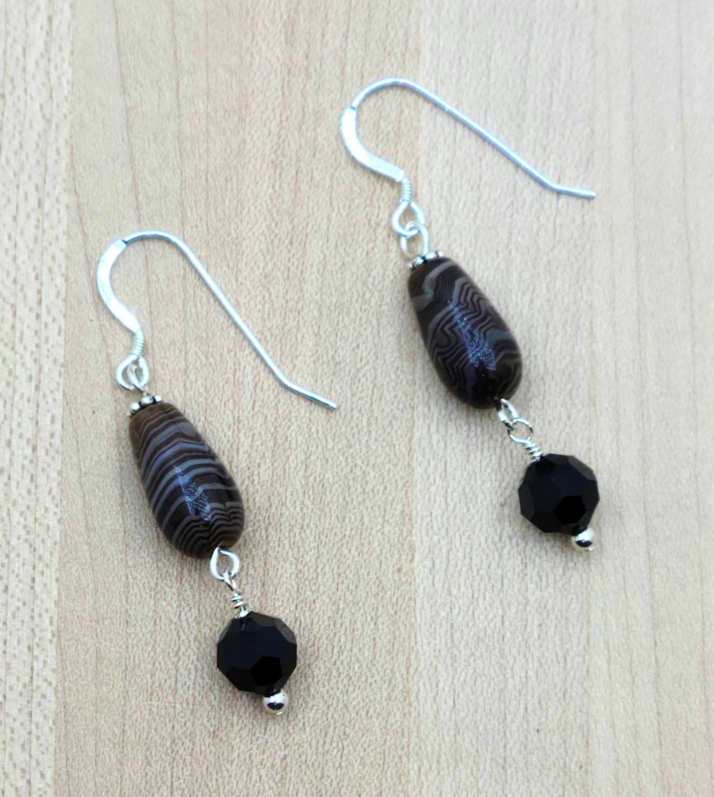 These caramel Tibetan agate barrel teardrops have the look of scrumptious, swirly dark chocolate! I paired them with large, brown/black crystals for an eye catching look. sterling silver fish hooks