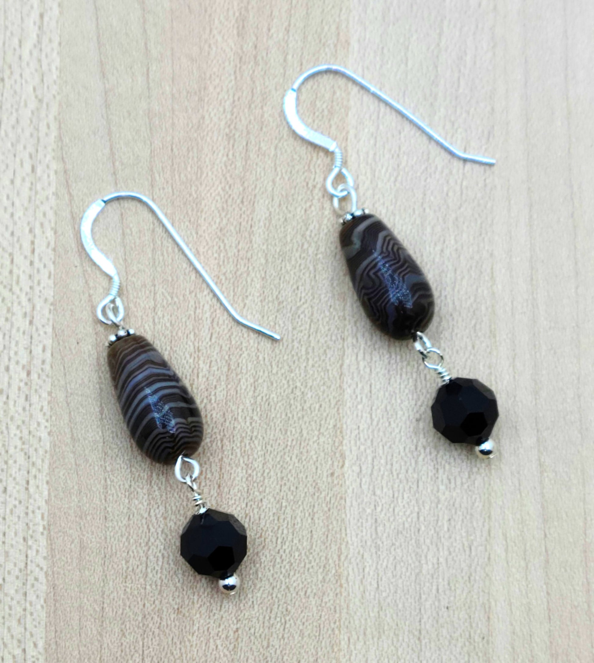These caramel Tibetan agate barrel teardrops have the look of scrumptious, swirly dark chocolate! I paired them with large, brown/black crystals for an eye catching look. sterling silver fish hooks