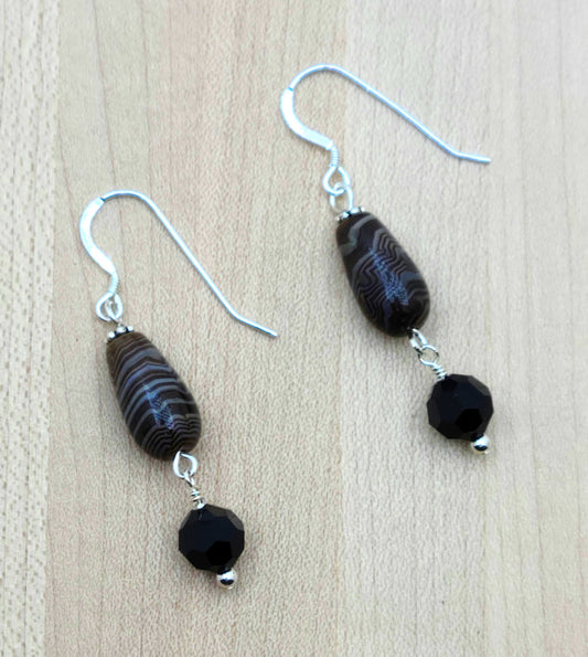 These caramel Tibetan agate barrel teardrops have the look of scrumptious, swirly dark chocolate! I paired them with large, brown/black crystals for an eye catching look. sterling silver fish hooks