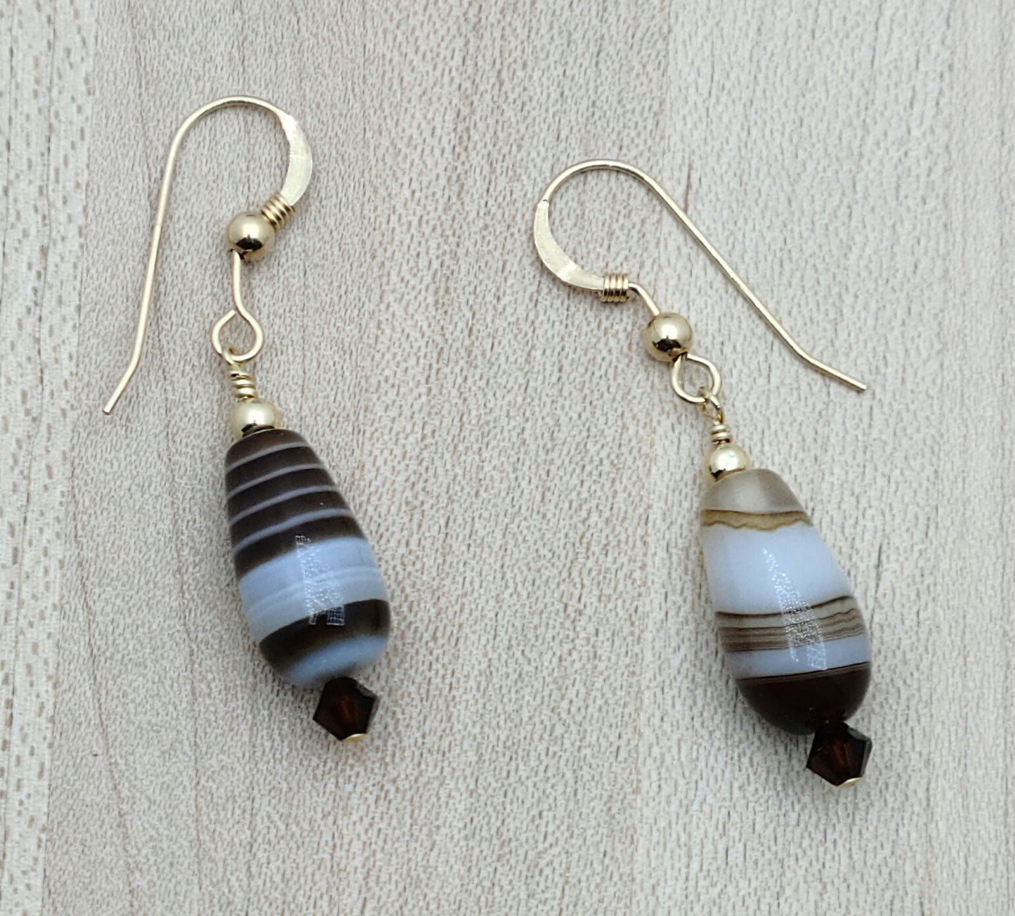 Sweet and stylish! This delightful set features Tibetan caramel agate that captures all the warmth of chocolate and caramel tones, paired with mocha crystals for extra richness. gold filled french hook ear wires
