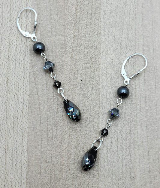 A dramatic look without bulk or weight! A combination of hematite and various shades of black crystals cascade with LOTS of movement!
Sterling silver fish hooks