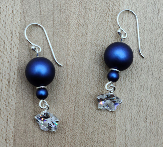 A gorgeous blue! Sparkling cubic zirconia flowers dangle elegantly from satiny iridescent blue crystal pearls in these lovely & lightweight earrings! sterling silver fish hooks