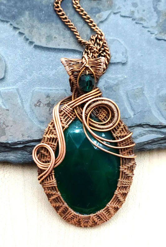 Meet your new emotional wellness companion—a stunning faceted large green onyx stone cradled in vintage antiqued copper wire and accented with an emerald crystal!