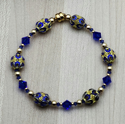 The deep, bright blue & gold of these filigree cloisonné beads & the rich blue of the crystals are definitely gorgeous!
