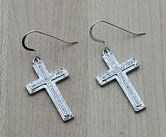 Bright stainless steel and embedded cubic zirconia will sparkle to call attention to the importance of your Christian faith!