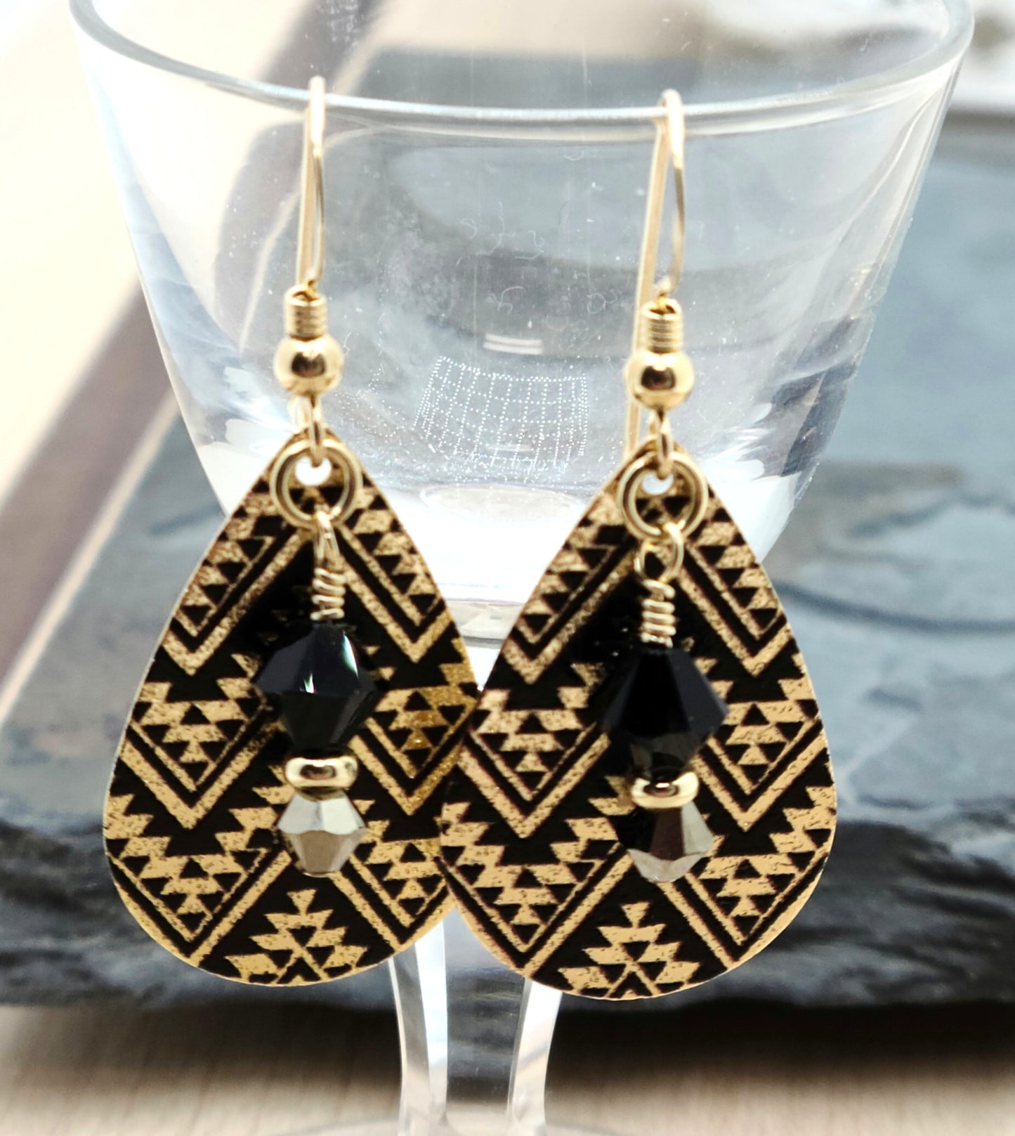 Black & gold chevrons are etched on metal and enhanced with black & gold crystals for lightweight, eye-catching earrings!
