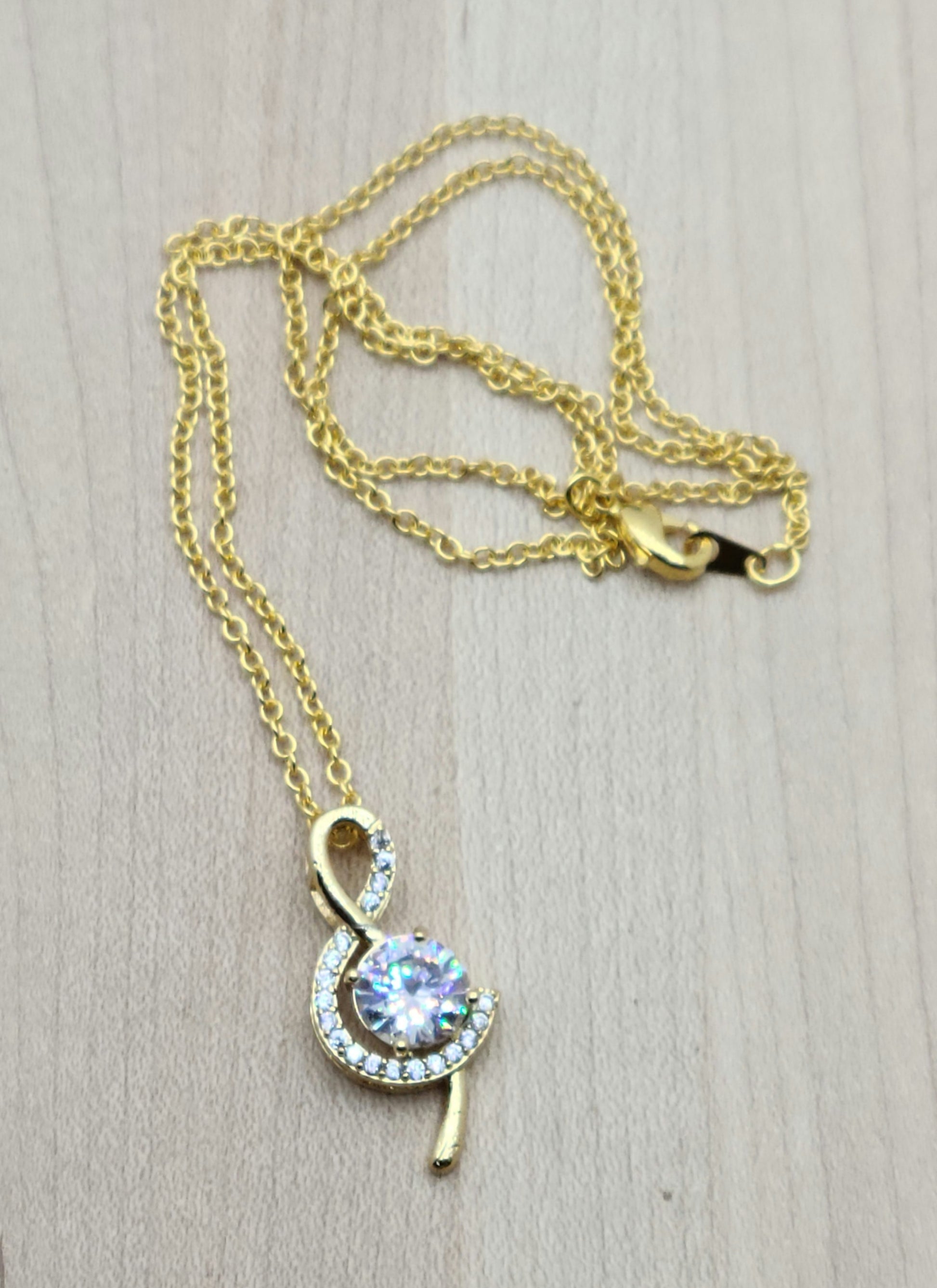 Musicians & music lovers will want this CZ enhanced treble clef necklace! 
