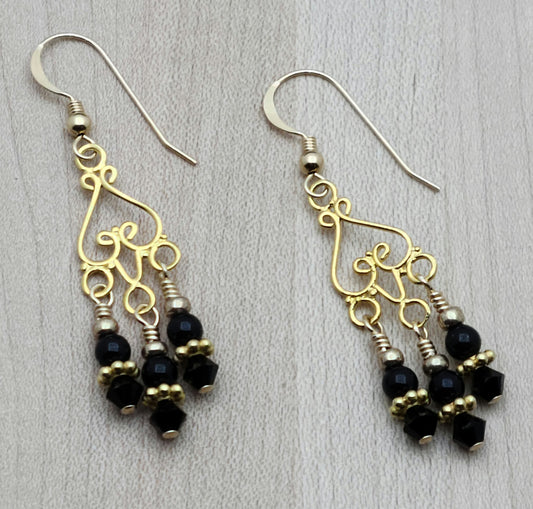 Gold Vermeil Chandeliers host dangles of black crystal pearls & black crystals in these earrings with gold filled fish hook earwires.
