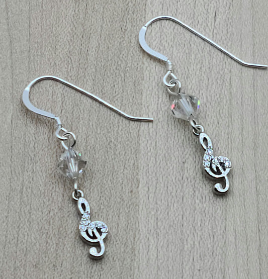 Sparkle with your love of music! Sterling silver &amp; cubic zirconia treble clefs catch the light, as do the crystals* from which they are suspended!