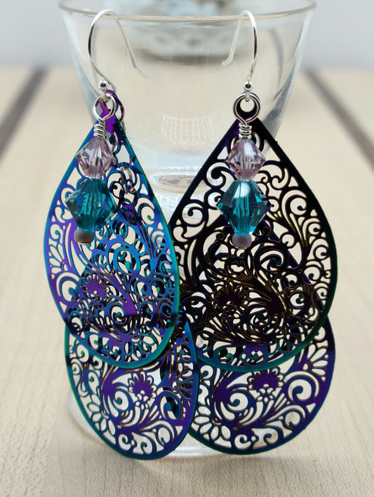 These incredibly lightweight electroplated teal & purple stainless steel teardrops have been laser cut with a swirling and intricate design. I added crystal ornaments for a 'bling' element.