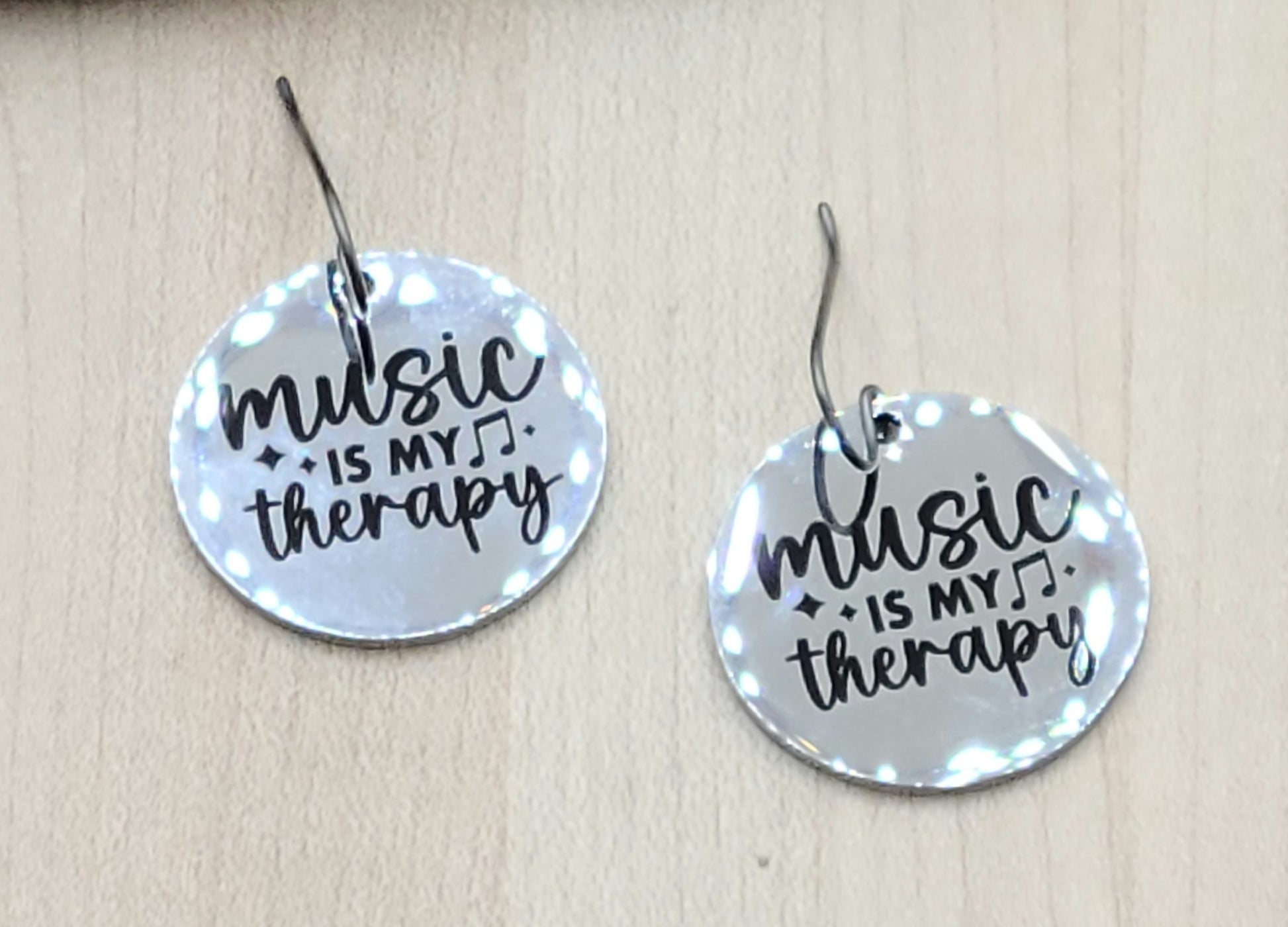 Does music both sooth & feed your soul? Then you need these stainless earrings announcing that "Music is My Therapy."