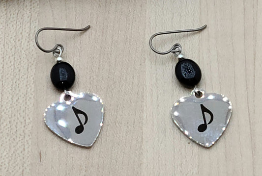 Love music? Play a group? Then these stainless steel hearts displaying an 8th note are for you! For added interest they hang from black onyx beads.
1 3/4" with niobium (considered hypoallergenic) fish hook earwires