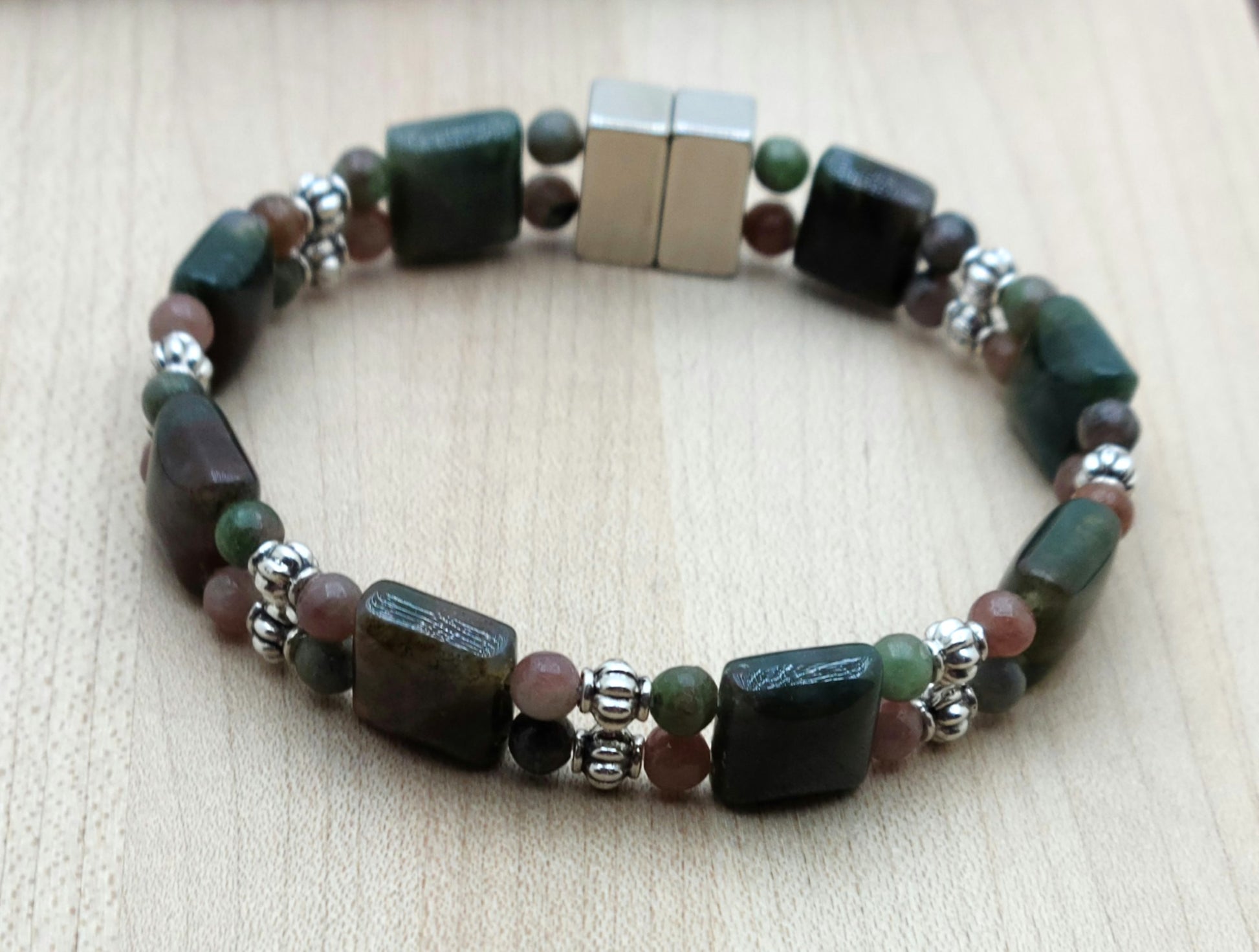 If you're a fan of green & all things earthy, this bracelet is for you! The deep green of the moss agate squares finds a great companion in the muted greens &  roses of Kashgar garnet. Bali style silver pewter beads add just enough brightness.
Neodymium magnetic clasp - these are awesome . . . & VERY strong!